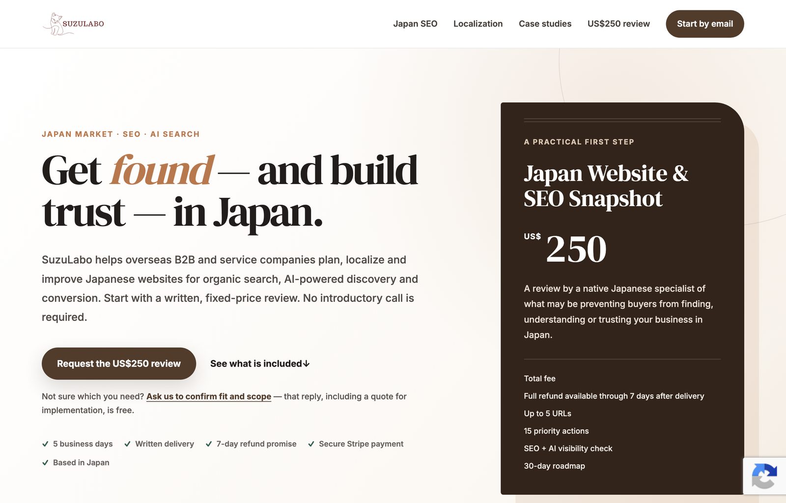 Screenshot of the English SuzuLabo page, with a different headline, a fixed-price offer card and its own calls to action.